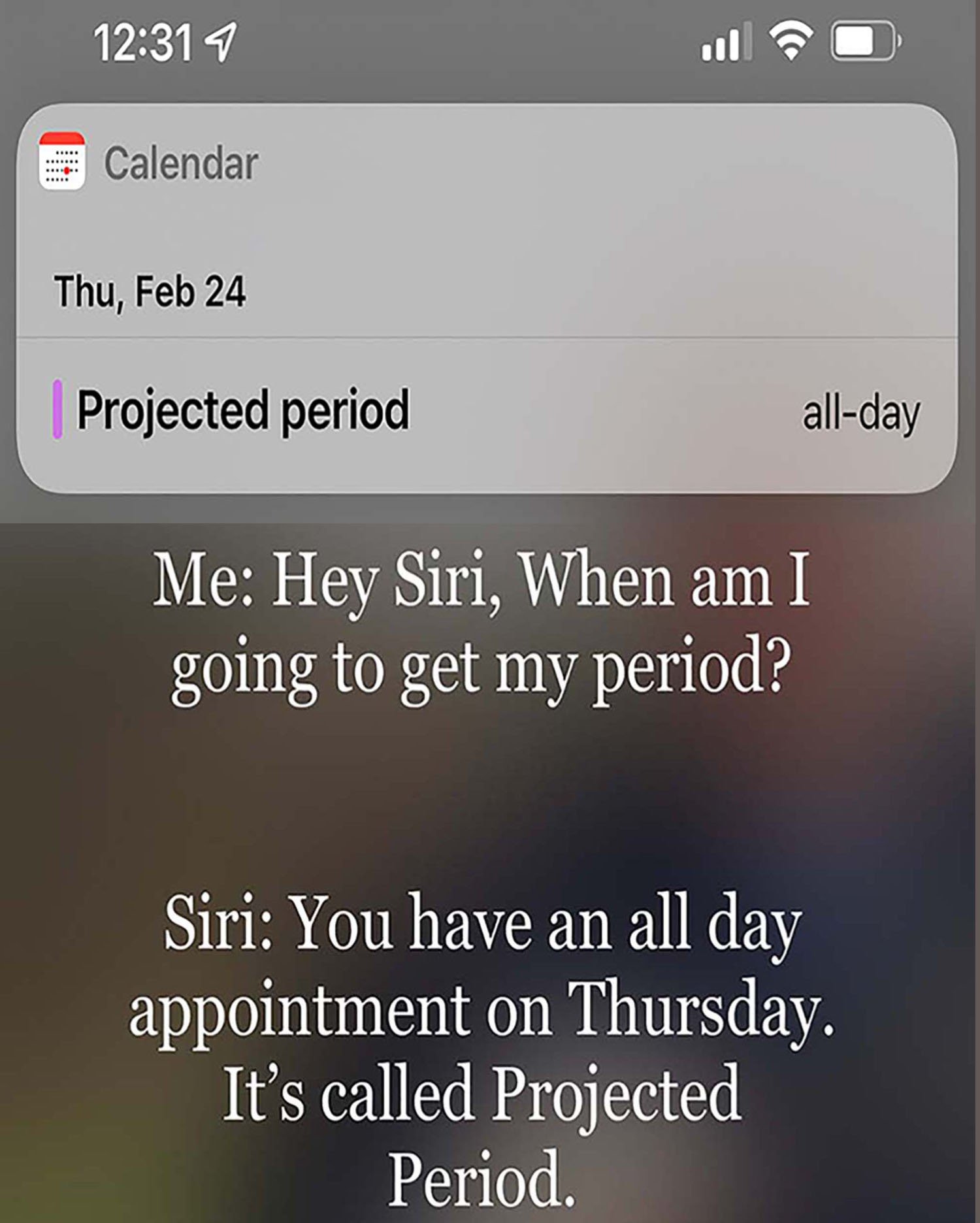 Screenshot of iPhone screen with calendar appointment named “Expected Period” on February 24, 2022. Text underneath reads, Me: “Hey Siri: when am I going to get my period?” Siri: “You have an all day appointment on Thursday. It’s called Projected Period.”
